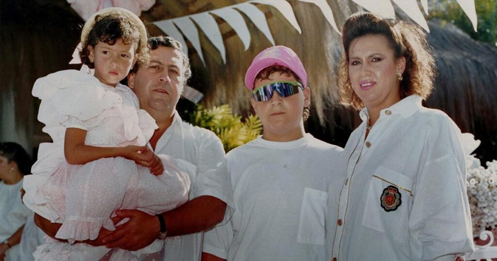 Manuela Escobar in his father's arm, with her brother and mother